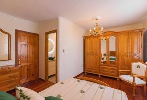 A bed or beds in a room at Casa Bértolo