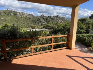 a porch with a view of a mountain at Costa Paradiso House in Li Valcaggi