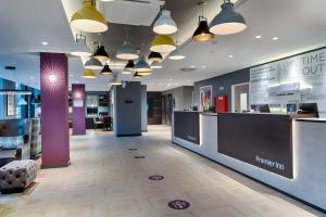 a lobby of a store with a reception desk at Premier Inn Berlin City Wilmersdorf in Berlin