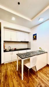 a kitchen with a table and a counter top at Homestay Times City 04T1N in Hanoi