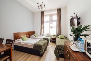 Postel nebo postele na pokoji v ubytování Apartamenty Bonerowska 5 + 37 fotografií
