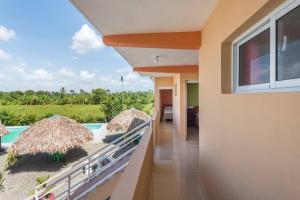 a view from the balcony of a resort with a swimming pool at HOTEL RANCHO EL NOVATO in Concepción de La Vega