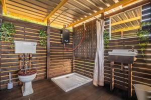 a bathroom with a toilet and a sink at Luxury glamping in Constable Country - Valley View Yurt 