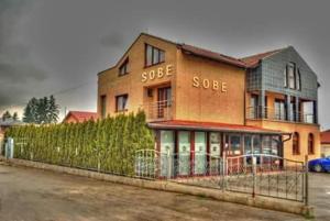 a brick building with the words sooe at Motel Bella Italia in Sarajevo