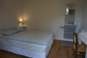 A bed or beds in a room at Le clos du 10