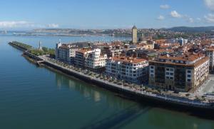 an aerial view of a city next to the water at Family Apartment / Apartamento familiar Getxo in Getxo