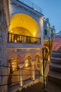 a building with a staircase in front of it at Janus Cappadocia Hotel in Nevsehir