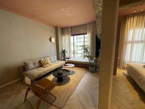 a living room with a couch and a table at GoodHouse 402 - 4 Bdr beautiful apartment in Jerusalem in Jerusalem