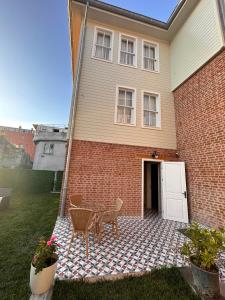 a patio with a table and chairs in front of a house at Lovely History in Istanbul +30 photos