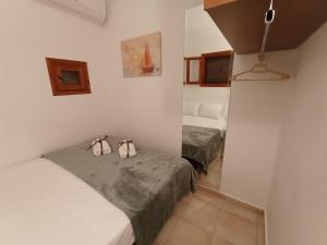 Ένα ή περισσότερα κρεβάτια σε δωμάτιο στο Kouros House - Zen Philosophy
