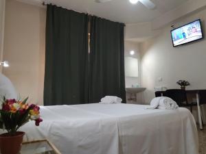 Postel nebo postele na pokoji v ubytování Pensione Trento
