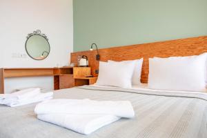 Postel nebo postele na pokoji v ubytování Mavilim Hotel