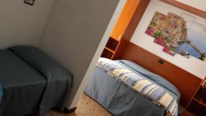 A bed or beds in a room at Hotel Europa