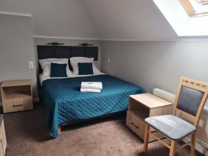 Un pat sau paturi într-o cameră la Hotel Savana