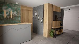 TV a/nebo společenská místnost v ubytování Szlakami 5 Dolin - apartamenty obok Doliny Strążyskiej - sauna i parking GRATIS!