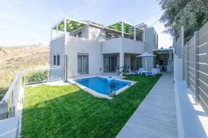 an image of a house with a swimming pool at Ilianthos in Panormos Rethymno