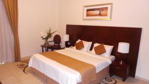 Postel nebo postele na pokoji v ubytování Akas-Inn Hotel Apartment