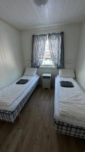 Tempat tidur dalam kamar di Nothaugen AS