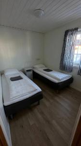 Tempat tidur dalam kamar di Nothaugen AS