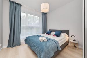 Posteľ alebo postele v izbe v ubytovaní Central SouthStar Apartments - Gwiaździsta - FREE PARKING by Noclegi Renters