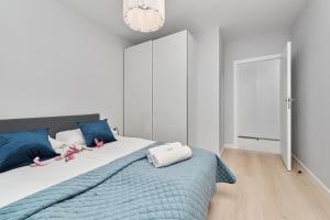 Posteľ alebo postele v izbe v ubytovaní Central SouthStar Apartments - Gwiaździsta - FREE PARKING by Noclegi Renters