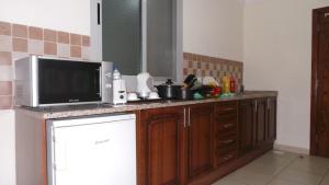Kuchyň nebo kuchyňský kout v ubytování Akas-Inn Hotel Apartment