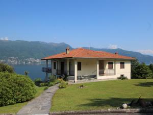a house on a hill with a view of the water at Holiday Home Antonia by Interhome in Porto Valtravaglia