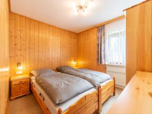 Ένα ή περισσότερα κρεβάτια σε δωμάτιο στο Apartment Am Hohen Bogen-56 by Interhome