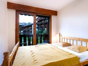 Posteľ alebo postele v izbe v ubytovaní Apartment Les G'rets-12 by Interhome