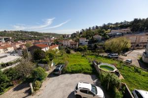 arial view of a parking lot with cars parked at KASA DUPLEX - Climatisation - Balcon - Parking Privé in Rive-de-Gier