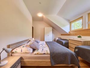 Postel nebo postele na pokoji v ubytování Apartment Ski-In Ski-Out Mountain Duplex Portášky2 by Interhome