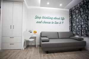 a living room with a couch and a desk at Apartment 4 You in Split in Split