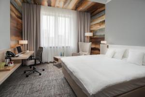 Posteľ alebo postele v izbe v ubytovaní Park Hotel & Restauracja Browar Brzeg