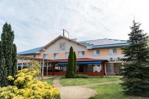 a building with solar panels on the roof at Panoráma Hotel in Békéscsaba