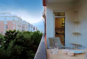 a table and chairs on a balcony with a view at Central and Serene Flat with Balcony in Antalya in Antalya