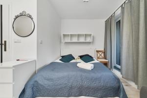 Posteľ alebo postele v izbe v ubytovaní Central SouthStar Apartments - Gwiaździsta - FREE PARKING by Noclegi Renters