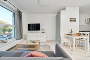 Televízia a/alebo spoločenská miestnosť v ubytovaní Central SouthStar Apartments - Gwiaździsta - FREE PARKING by Noclegi Renters