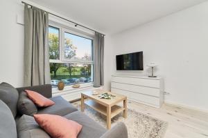 Televízia a/alebo spoločenská miestnosť v ubytovaní Central SouthStar Apartments - Gwiaździsta - FREE PARKING by Noclegi Renters
