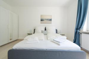 Postel nebo postele na pokoji v ubytování 2 Zimmer Ferienwohnung Am Hafen