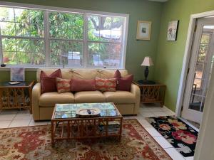 a living room with a couch and a table at One Bed Suite near Beaches and Downtown Sarasota in Sarasota