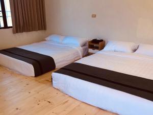 Una cama o camas en una habitación de Starry Sky Hostel