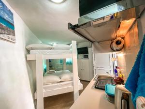 a small room with two bunk beds in it at Sea View Studio Armenistis Ikarias No2 in Armenistis