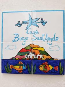 a sign for a boca beach gulf angle at Casa Borgo Sant'Angelo in Ischia