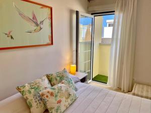 Łóżko lub łóżka w pokoju w obiekcie Home2Book El Encanto La Laguna Centro Histórico