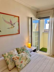 Łóżko lub łóżka w pokoju w obiekcie Home2Book El Encanto La Laguna Centro Histórico