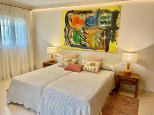 Łóżko lub łóżka w pokoju w obiekcie Home2Book El Encanto La Laguna Centro Histórico
