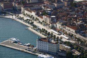 an aerial view of a city with boats in the water at Apartment 4 You in Split in Split