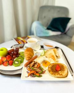 a plate of breakfast food on a table at The Gibs Hotel Limited in Port Harcourt