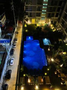 an overhead view of a swimming pool at night at S & E Condo with Panoramic View in Iloilo City