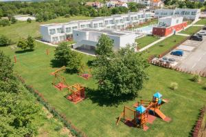 an aerial view of a park with a playground at Maj Luxury Residence in Poreč